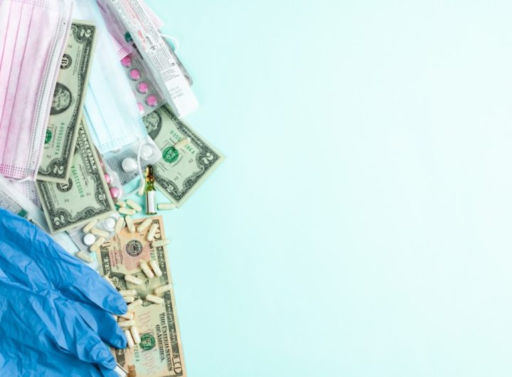 Medical items and cash scattered on a surface